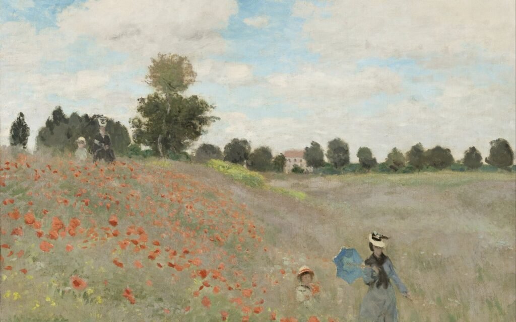 Women and a child walking through a summer meadow full of red poppies